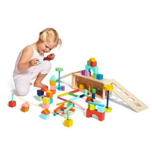 Toddler playing with The Block Set by Lovevery