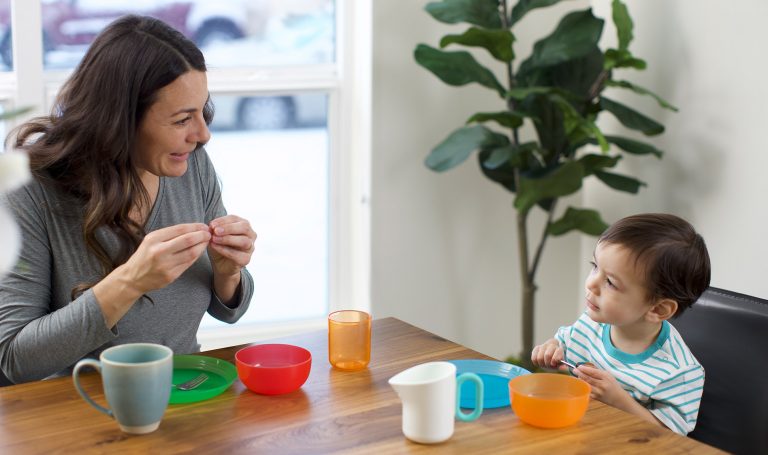 Mom uses sign language with her child