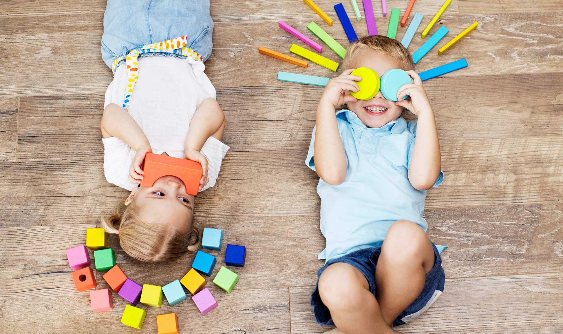 Children play with colorful blocks