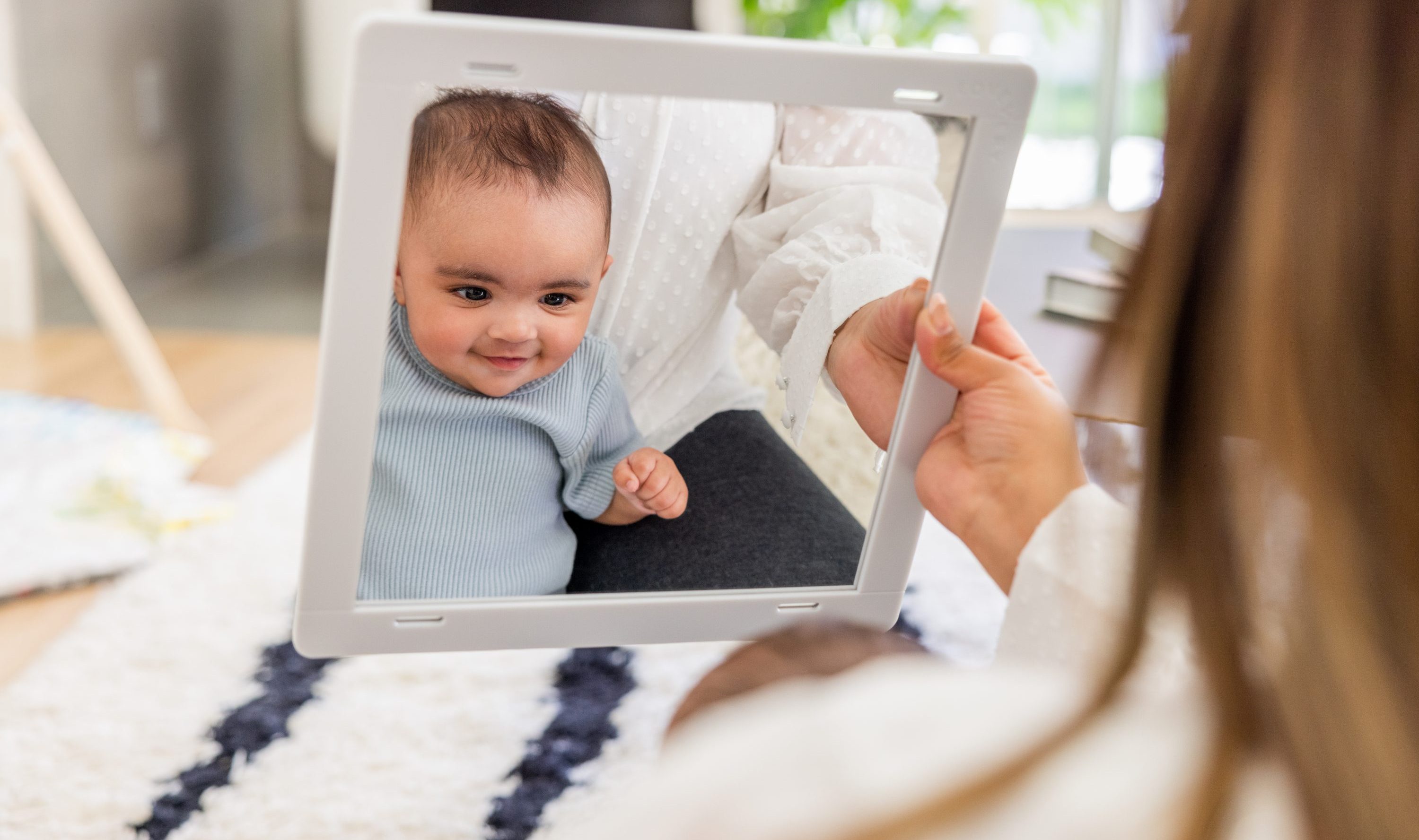 Why do babies love looking at mirrors 